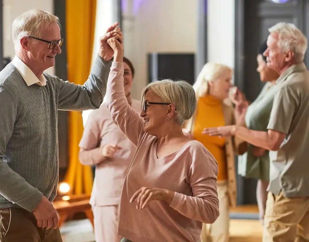 Seniors dancing together at a social event