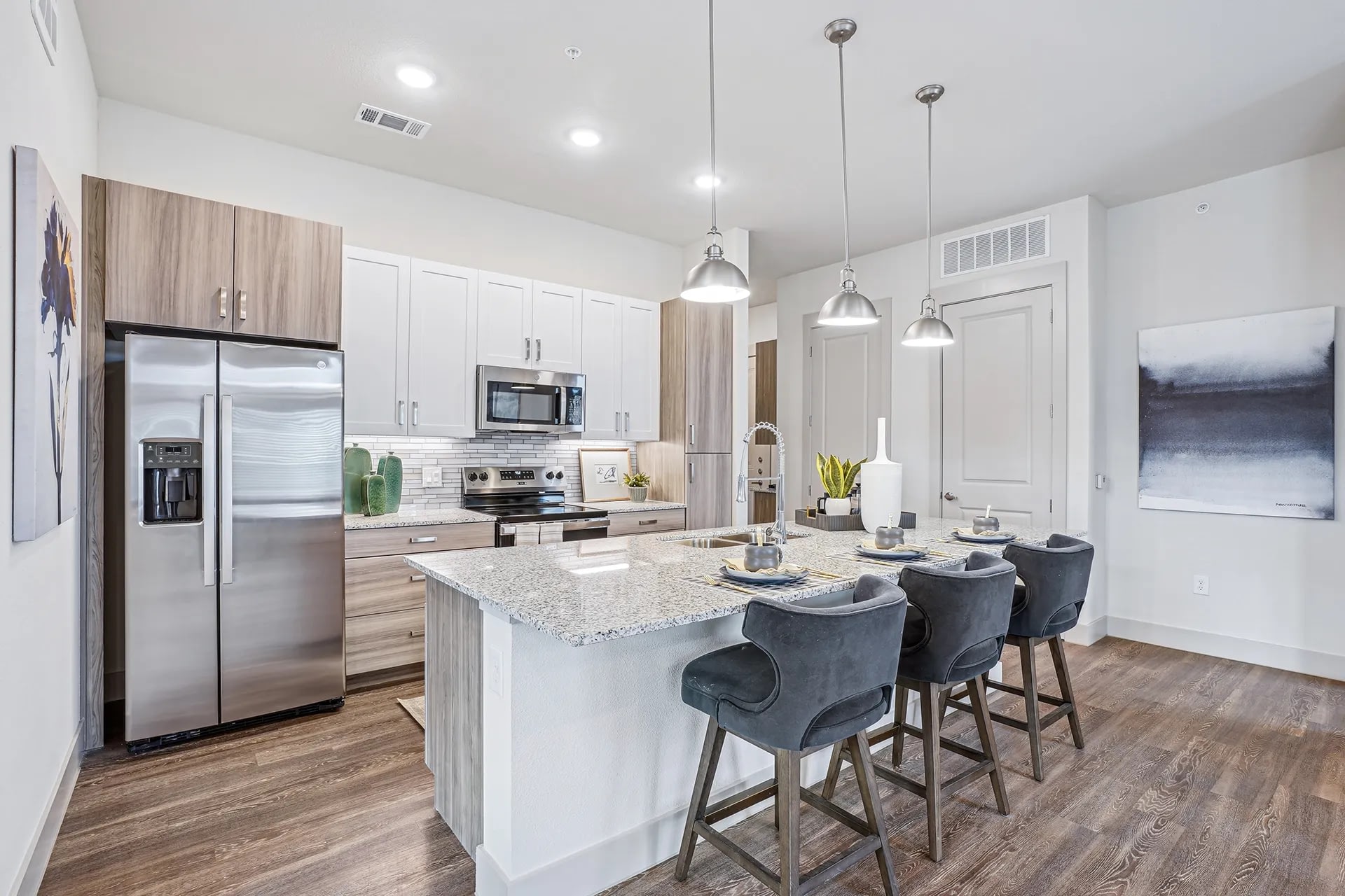 Kitchen and living room connected by a large central island.