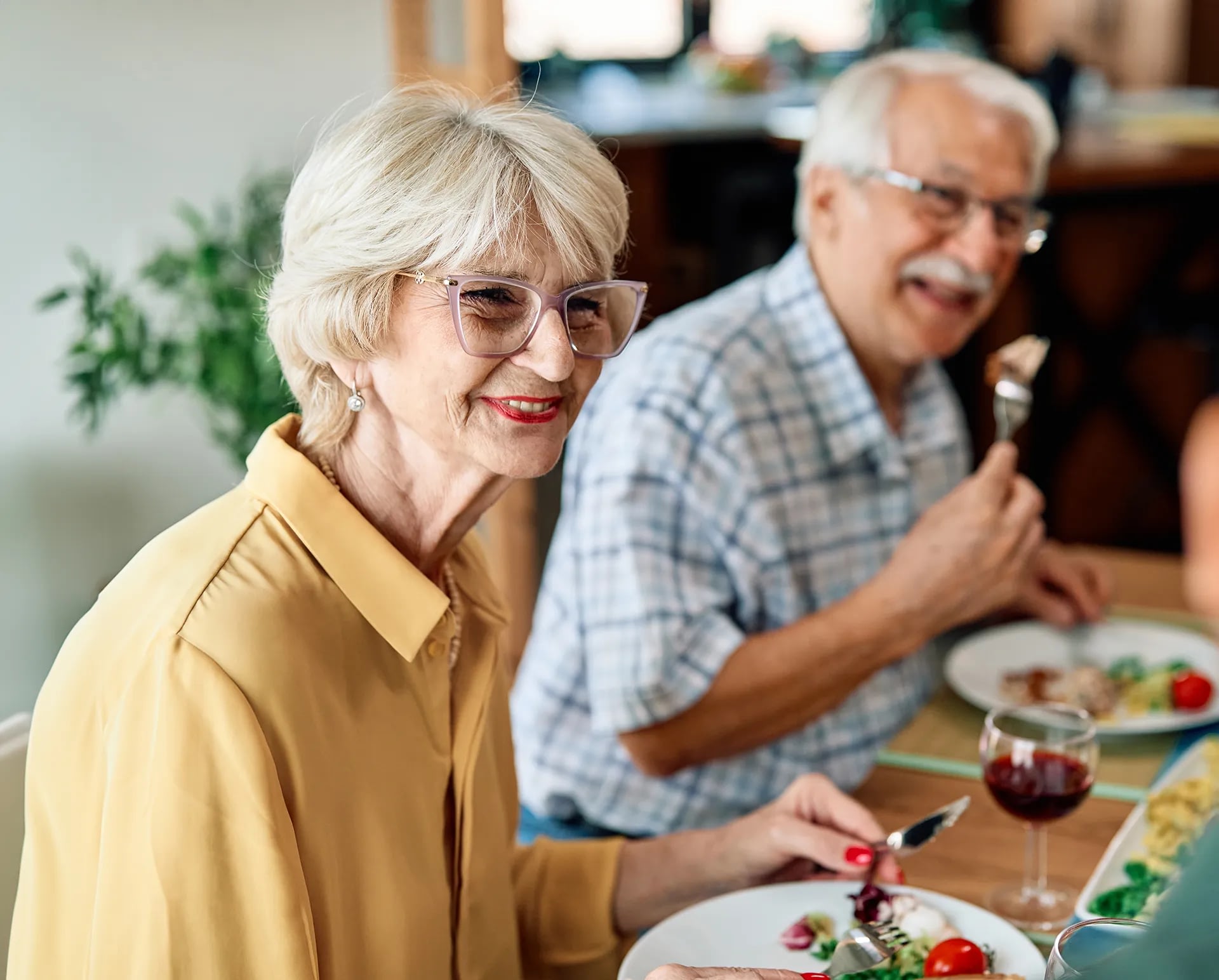 Senior couple enjoying meal together at home