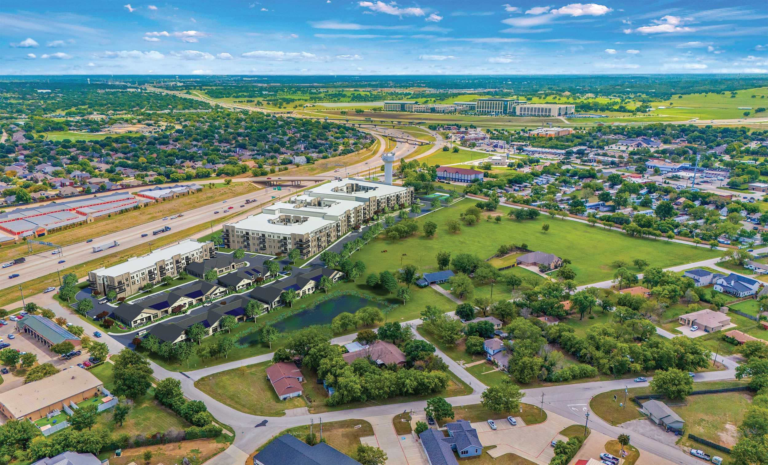 Aerial view of suburban housing development and highway.