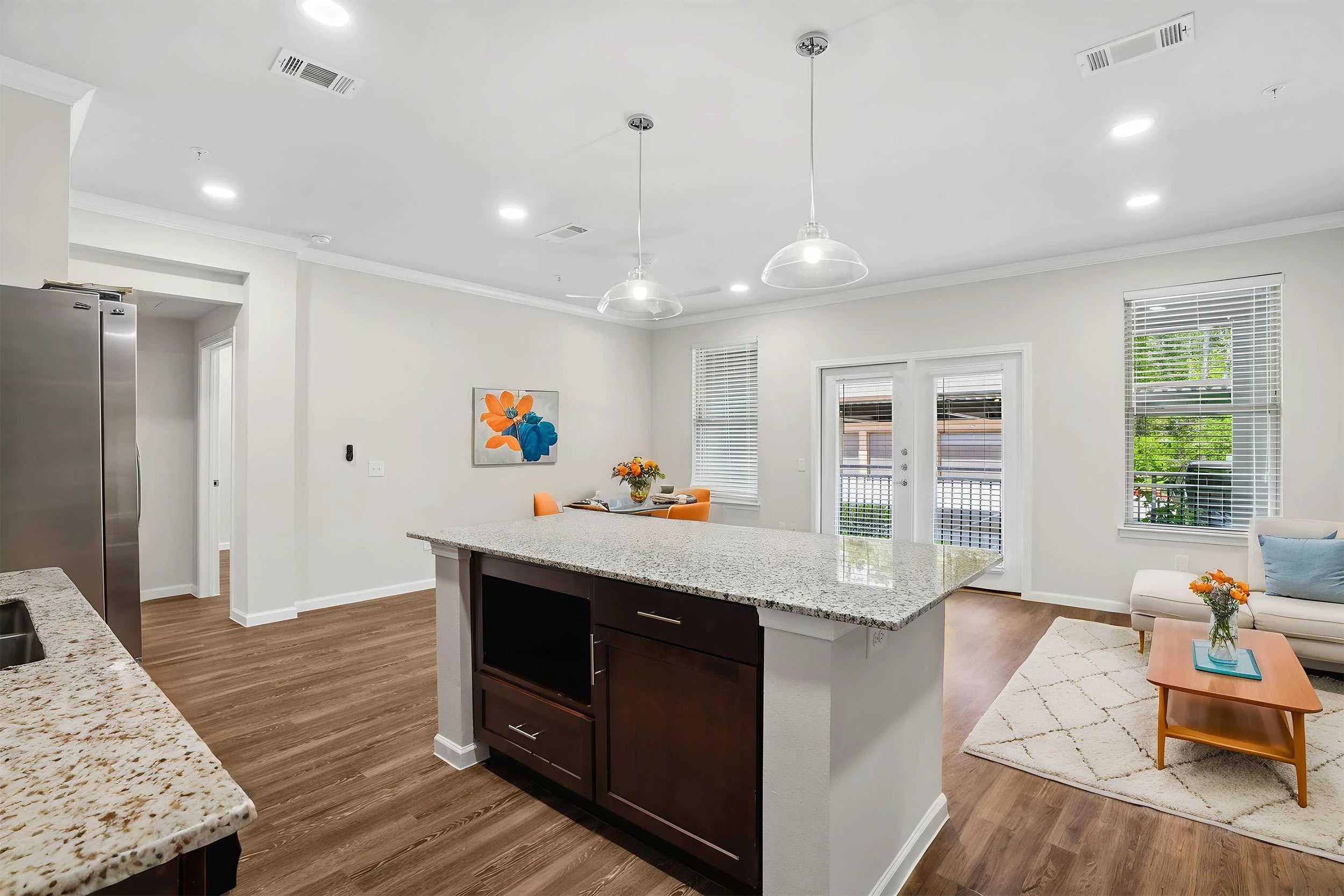 Modern kitchen and living room with natural light