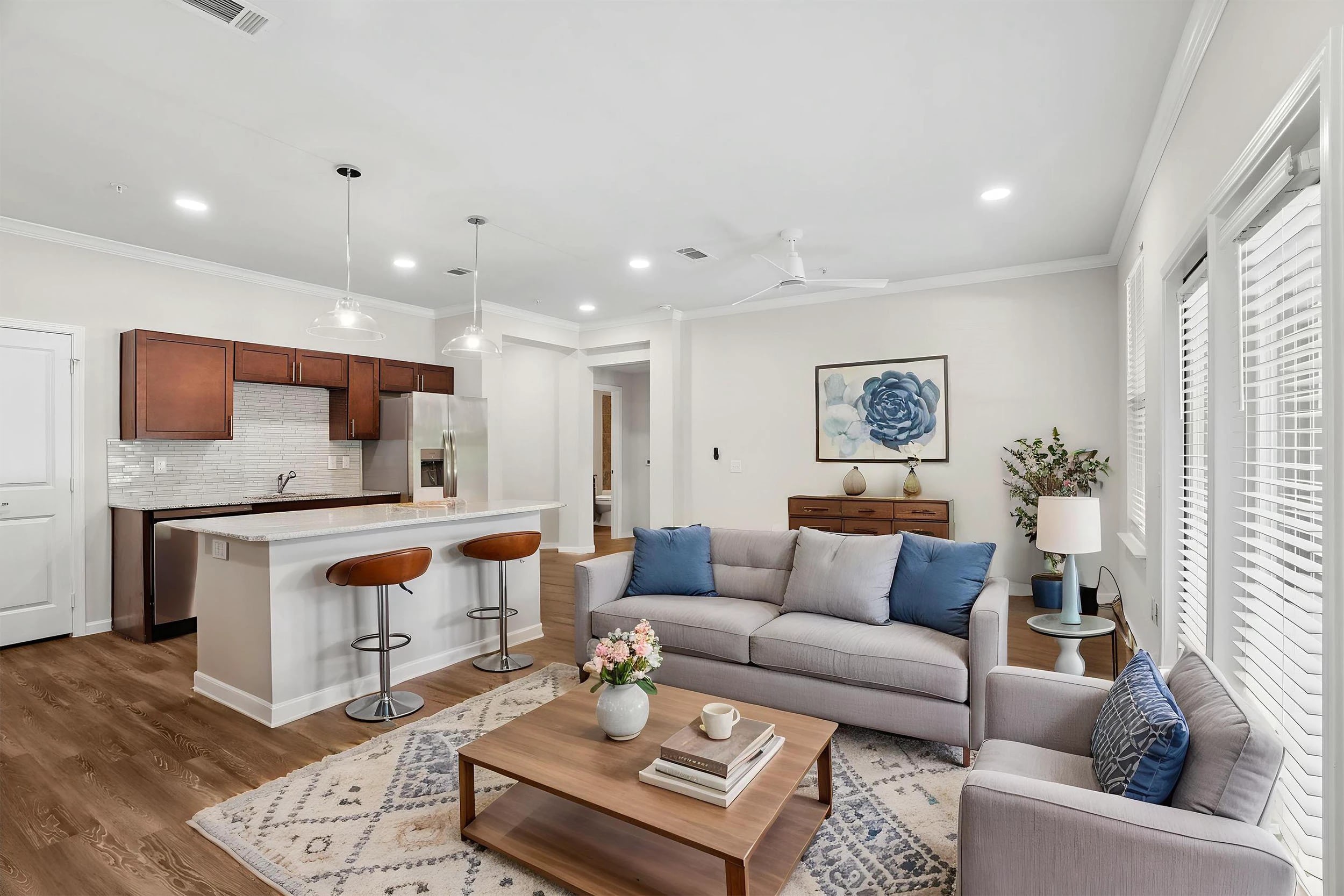Modern living room and kitchen with neutral decor