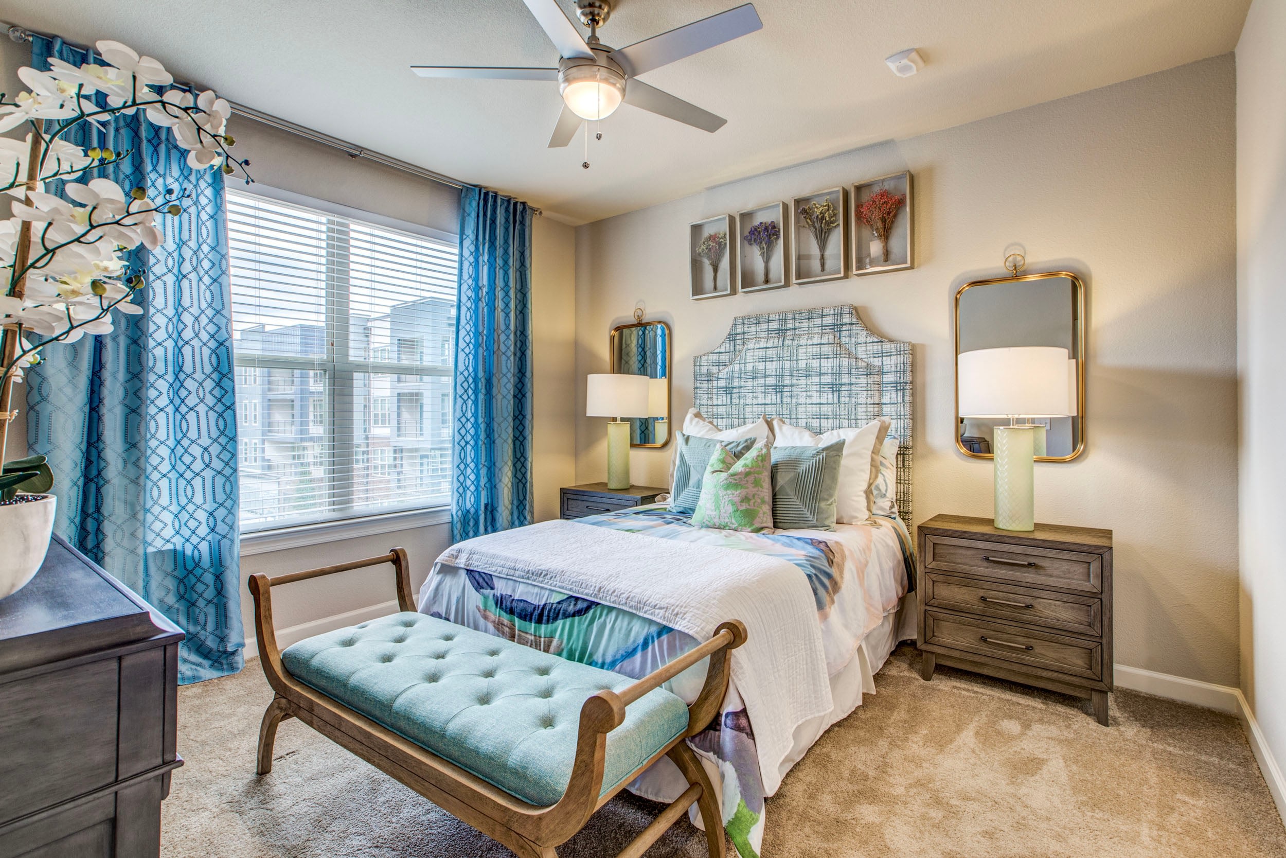 Modern bedroom with blue accents and natural light